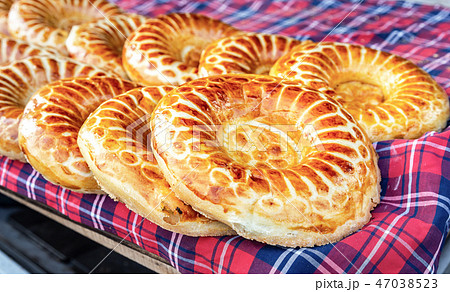 Baked traditional uzbek round flatbread Baked traditional uzbek round flatbread 47038523