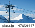 Chair lift on a background of mountains and sky 47039447