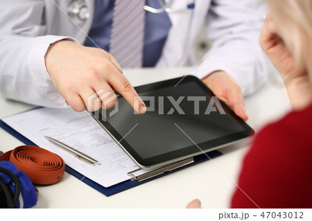 Female doctor hands hold and show digital Female doctor hands hold and show digital 47043012