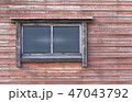 wooden and  glass window in the redwood wall 47043792