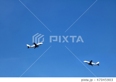 Airplane in the sky with white clouds and blue sky 47045903