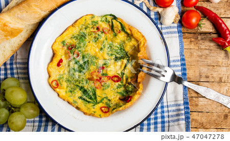Egg omelet with marijuana leafs on a plate 47047278