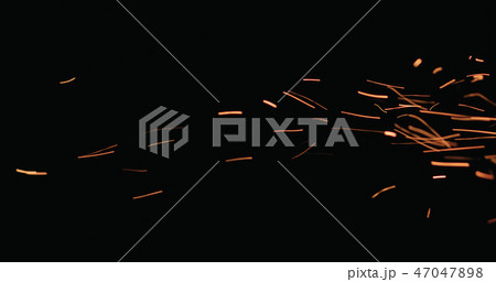 hot sparks floating from side on black background hot sparks floating from side on black background 47047898