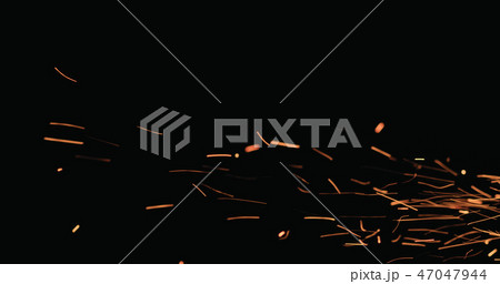 hot sparks floating from side on black background hot sparks floating from side on black background 47047944