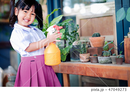 Happy Cute Asian Girl Enjoying with Gardening Happy Cute Asian Girl Enjoying with Gardening 47049273