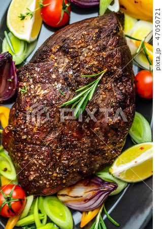 Club Beef steak with pepper sauce and Grilled vegetables on dark wooden background. Roas beef. Copy Club Beef steak with pepper sauce and Grilled vegetables on dark wooden background. Roas beef. Copy 47050721