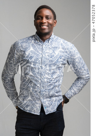 portrait of smiling dark-skinned young man isolated on white background 47052378