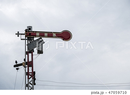 Traffic signal pole in railway yard. 47059710
