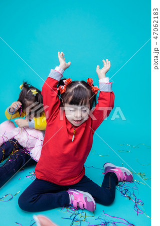 Happy little girls with genetic disorder playing with toys 47062183