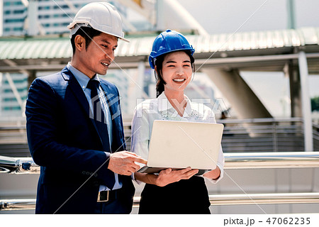 Lead Engineer train his trainee at the field Lead Engineer train his trainee at the field 47062235