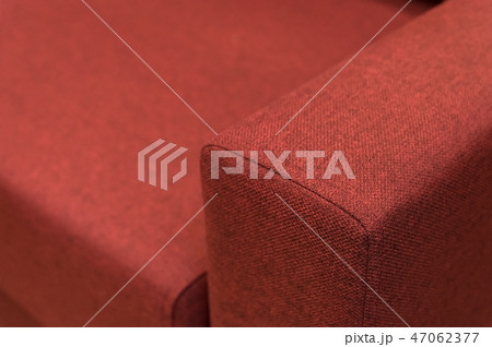 Close-up handle armrest textile red sofa. New furniture. Shallow depth of field 47062377