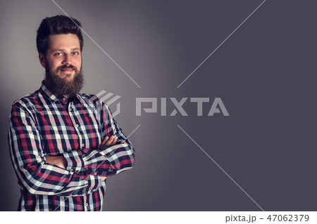 Smiling man in checked shirt 47062379