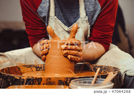 Potter makes a jug Potter makes a jug 47064268