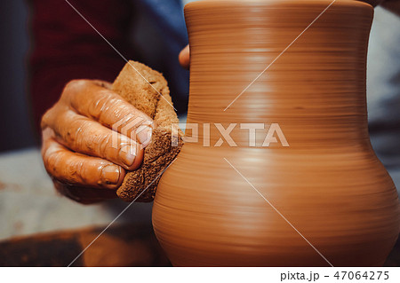 Potter makes a jug 47064275