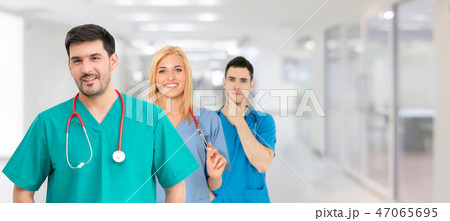 Doctor working in hospital with other doctors. 47065695