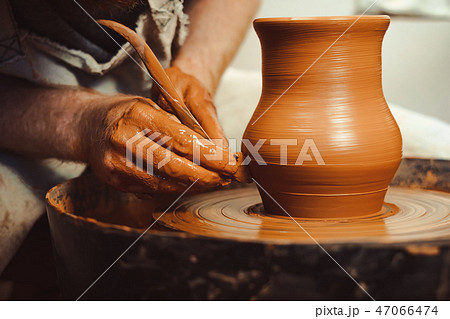 Potter makes a jug 47066474
