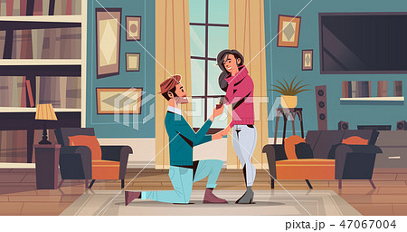 man kneeling holding engagement ring proposing woman marry him happy valentines day concept couple man kneeling holding engagement ring proposing woman marry him happy valentines day concept couple 47067004