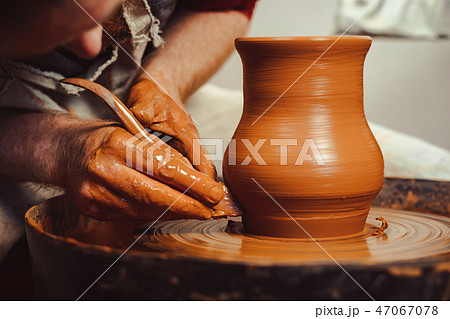 Potter makes a jug 47067078