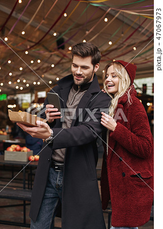 Couple taking pictures of mexican food. The concept of Mexican cuisine. Couple taking pictures of mexican food. The concept of Mexican cuisine. 47067973