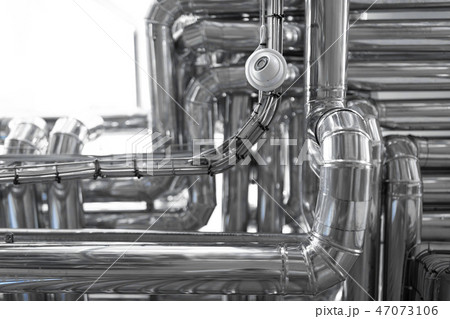 Steel pipelines isolated on cheese manufacture background Steel pipelines isolated on cheese manufacture background 47073106