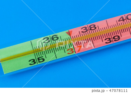 Medical thermometer on blue background Medical thermometer on blue background 47078111