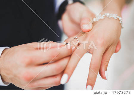 Bride and groom exchanging wedding rings. Stylish couple official ceremony 47078278