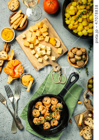 Shrimps roasted on frying cast iron pan 47078838