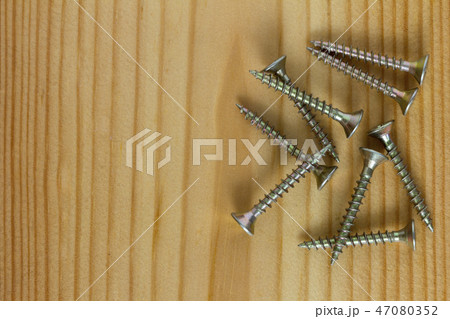 Close-up on screws, metal screws, iron screws 47080352