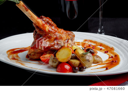 delicious restaurant dish, rack of lamb in restaurant background. Healthy exclusive food on big delicious restaurant dish, rack of lamb in restaurant background. Healthy exclusive food on big 47081660
