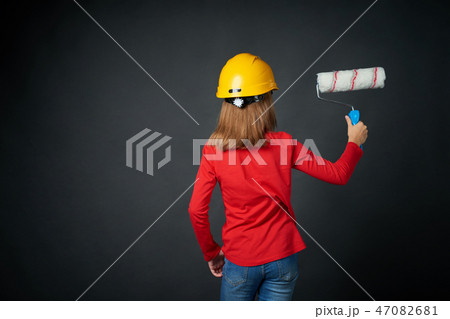 Decoration, renovation and reconstrucion concept. Painting girl 47082681