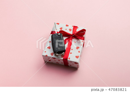 Give gift car key concept top view. Present box  47083821