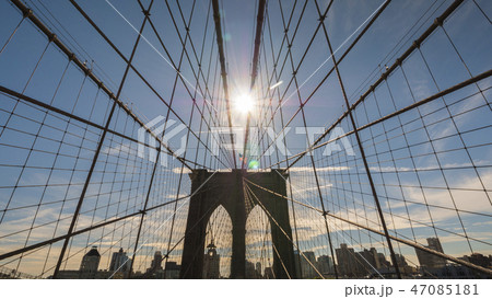 The sun shines over the Brooklyn Bridge in New York The sun shines over the Brooklyn Bridge in New York 47085181
