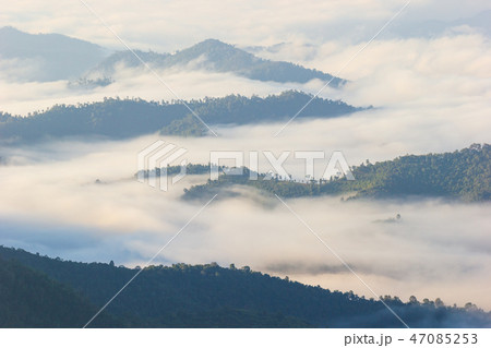 fog moves along the mountains in the morning. 47085253