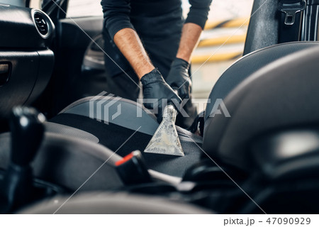 Dry cleaning of car interior with vacuum cleaner Dry cleaning of car interior with vacuum cleaner 47090929