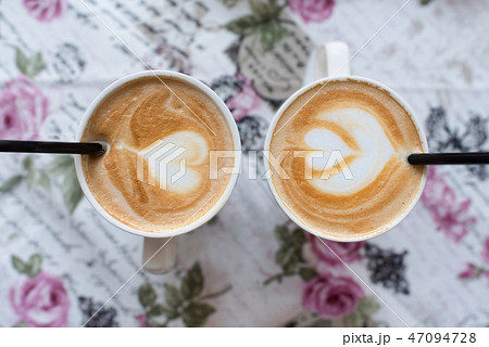 Two latte cups with a heart-shaped pattern, top view. Latte art. Valentine's Day Concept 47094728