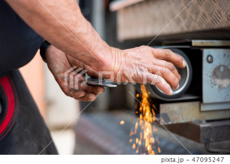 metalworking industry: finishing metal working on horizontal surface grinder machine with flying 47095247