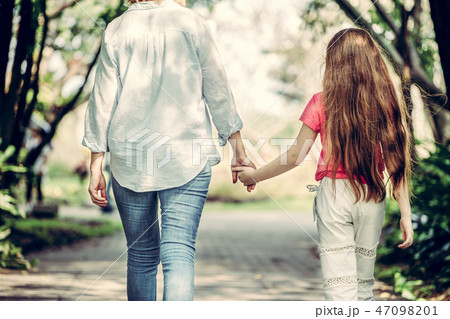 Happy mother and little kid daughter in park. Happy mother and little kid daughter in park. 47098201