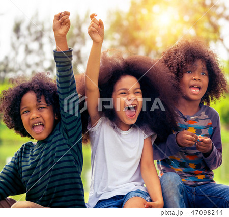 Happy kids group playing in the park in school. Happy kids group playing in the park in school. 47098244