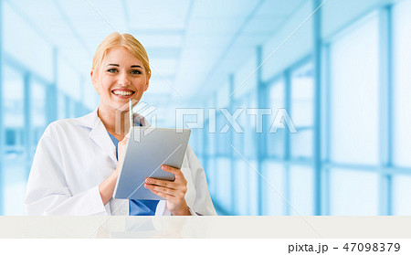 Doctor using tablet computer at the hospital. 47098379