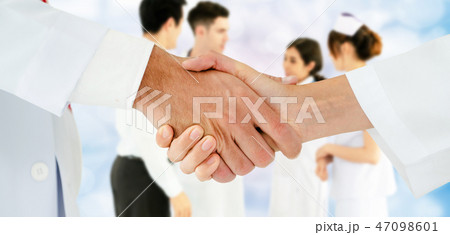 Doctor working in hospital with other doctors. 47098601