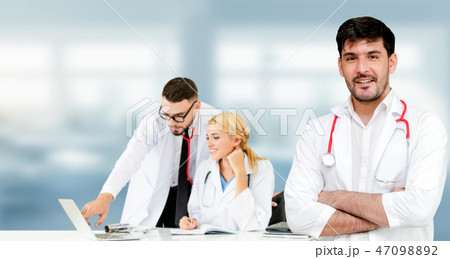 Doctor working in hospital with other doctors. Doctor working in hospital with other doctors. 47098892