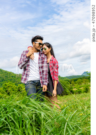 Happy couple take a romantic walk on the hills. Happy couple take a romantic walk on the hills. 47098952