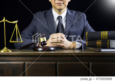justice and law concept.Male judge in a courtroom working on woo justice and law concept.Male judge in a courtroom working on woo 47099966