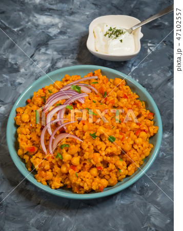 Turkish bulgur pilaf with chickpeas and tomatoes. 47102557