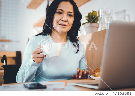Tired woman working remotely 47103681
