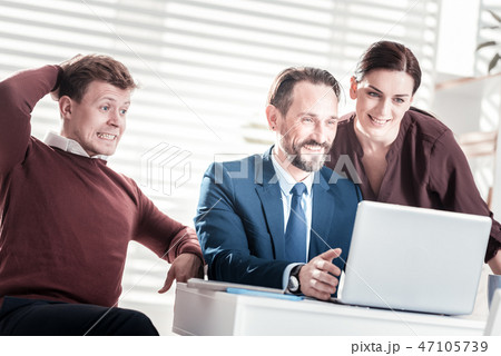 Positive three colleagues receiving report 47105739