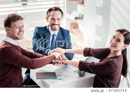 Jovial three colleagues achieving goals Jovial three colleagues achieving goals 47105753