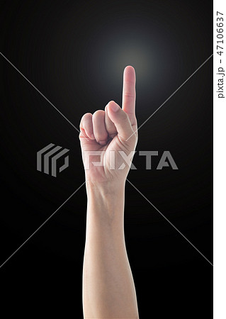 Pointing finger woman hand with rim light isolated Pointing finger woman hand with rim light isolated 47106637