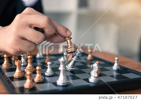 Businessman playing chess game beat opponent Businessman playing chess game beat opponent 47107027