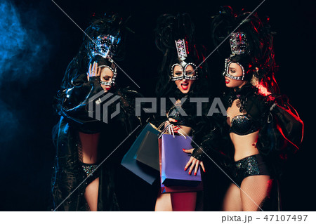 young beautiful dancers posing on studio background 47107497
